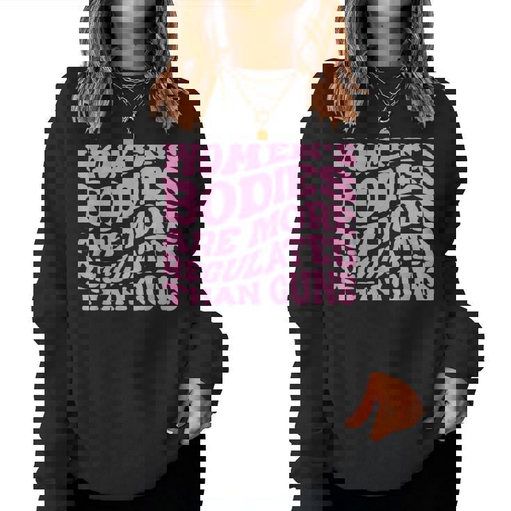 Womens Bodies Are More Regulated Than Guns Pro-Choice Women Crewneck Graphic Sweatshirt Womens Bodies Are More Regulated Than Guns Pro-Choice Women Crewneck Graphic Sweatshirt