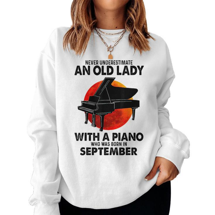 Never Underestimate An Old Lady With A Piano Born September Women Crewneck Graphic Sweatshirt