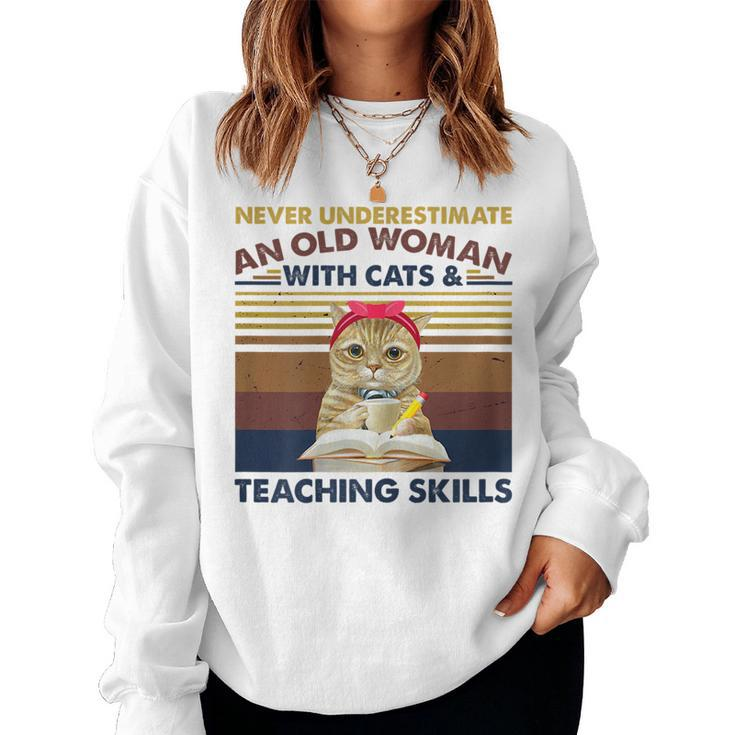 Never Underestimate An Old Woman With Cats & Teaching Skills Gift For Womens Women Crewneck Graphic Sweatshirt