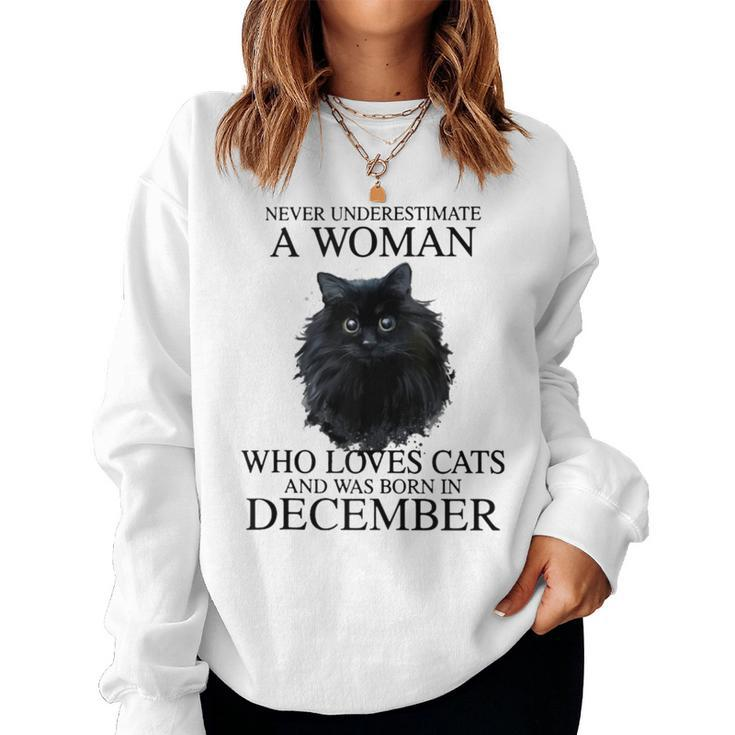 Never Underestimate A Woman Who Loves Cats Born In December Women Sweatshirt