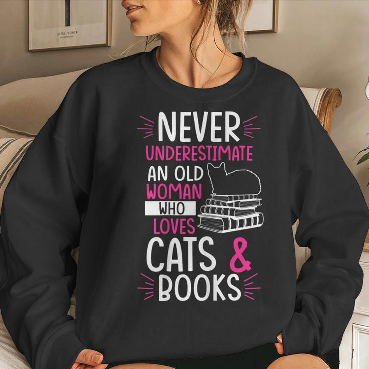 Never Underestimate An Old Woman Who Loves Cats & Books Gift Gift For Womens Women Crewneck Graphic Sweatshirt Gifts for Her