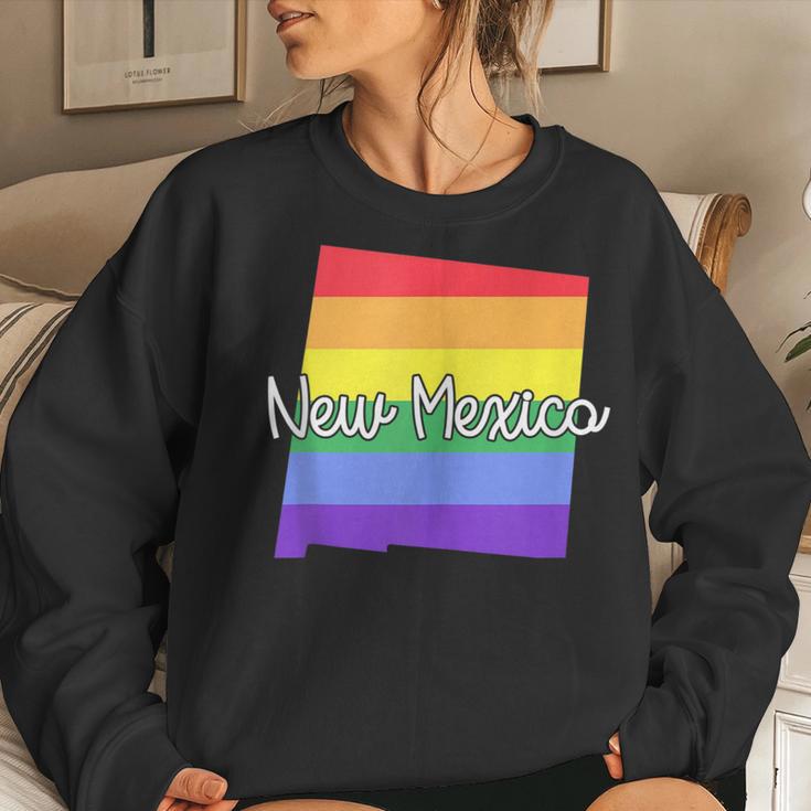 new-mexico-gay-pride-parade-state-map-rainbow-flag-script-women