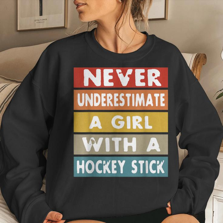 Never Underestimate A Girl With A Hockey Stick Women Sweatshirt Gifts for Her