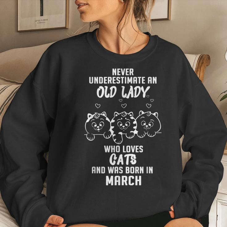 Never Underestimate An Old Lady Who Loves Cats Born In March Women Sweatshirt Gifts for Her