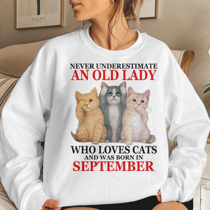 Never Underestimate An Old Lady Who Loves Cats September Women Crewneck Graphic Sweatshirt Gifts for Her