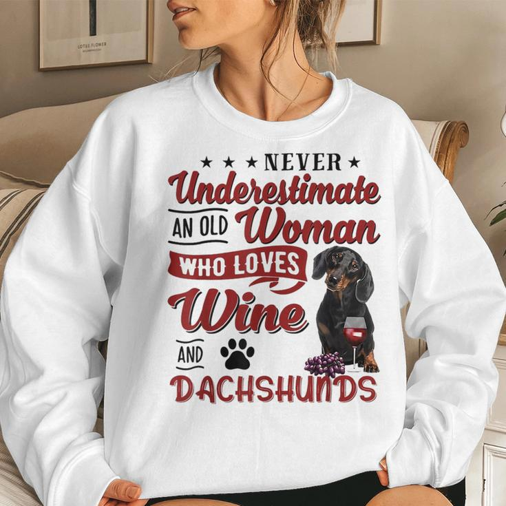 Never Underestimate An Old Woman Who Loves Wine & Dachshund Women Crewneck Graphic Sweatshirt Gifts for Her