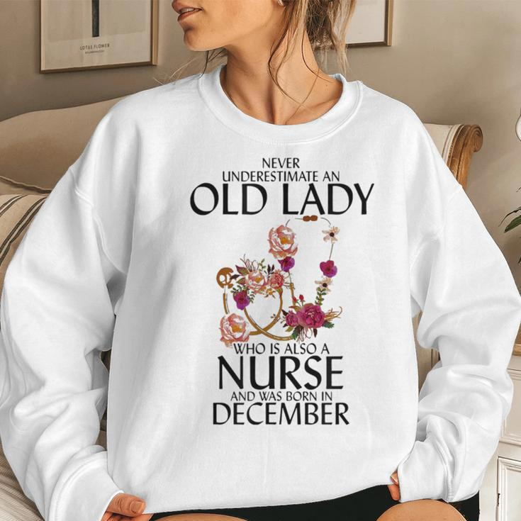 Never Underestimate An Old Lady Who Is Also A Nurse December Women Sweatshirt Gifts for Her