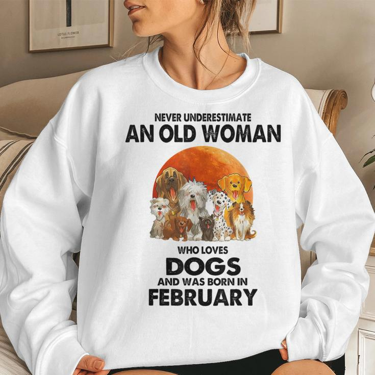 Never Underestimate An Old Woman Who Loves Dogs February Women Sweatshirt Gifts for Her
