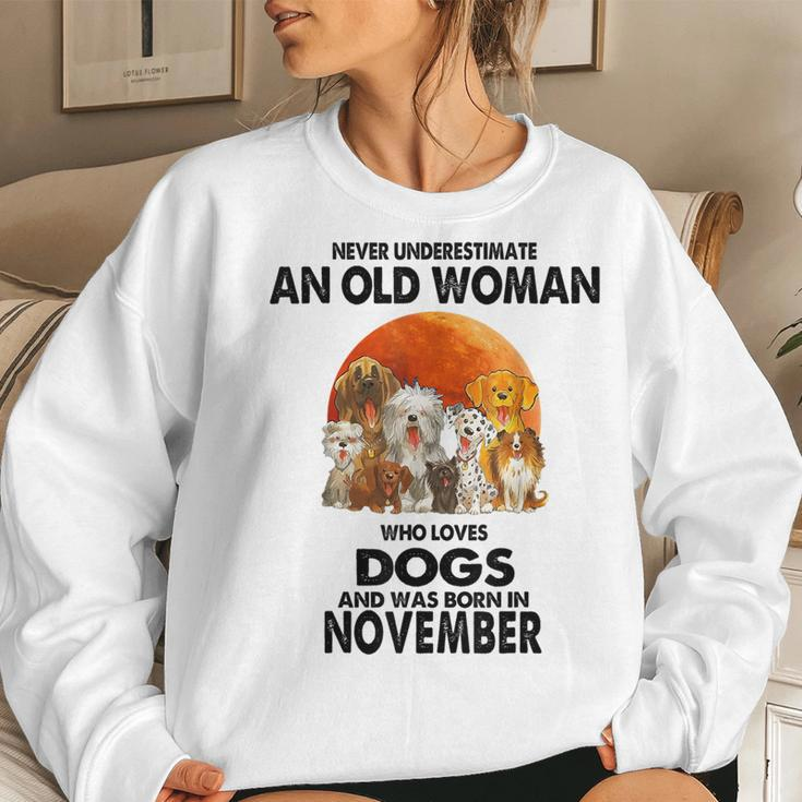 Never Underestimate An Old Woman Who Loves Dogs November Women Sweatshirt Gifts for Her