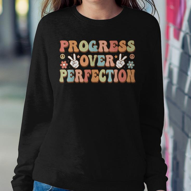 Back To School Progress Over Perfection Teacher Groovy Women Sweatshirt Unique Gifts