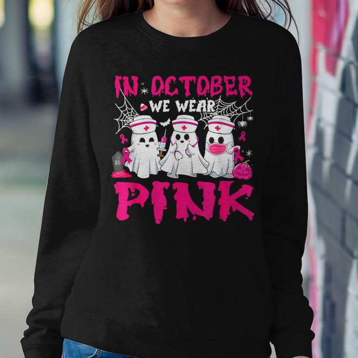 In October We Wear Pink Nurse Ghost Halloween Breast Cancer Women Sweatshirt Unique Gifts