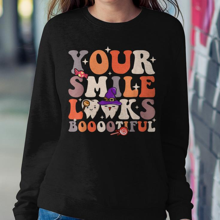 Your Smile Looks Bootiful Dentist Halloween Spooky Groovy Women Sweatshirt Unique Gifts