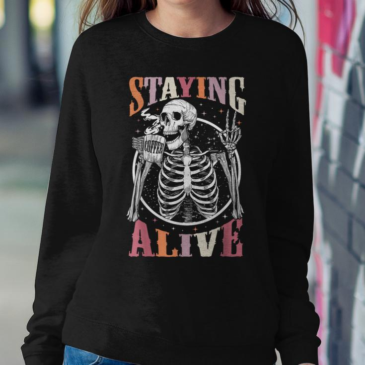 Staying Alive Skeleton Drinking Coffee Lover Halloween Women Sweatshirt Unique Gifts