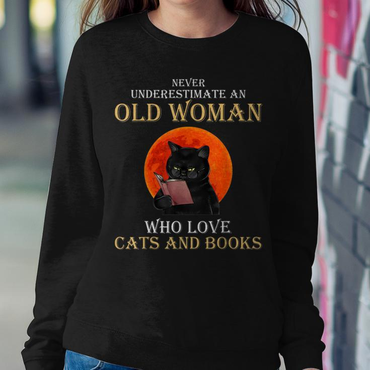 Never Underestimate An Old Woman Who Love Cats And Books Women Sweatshirt Funny Gifts