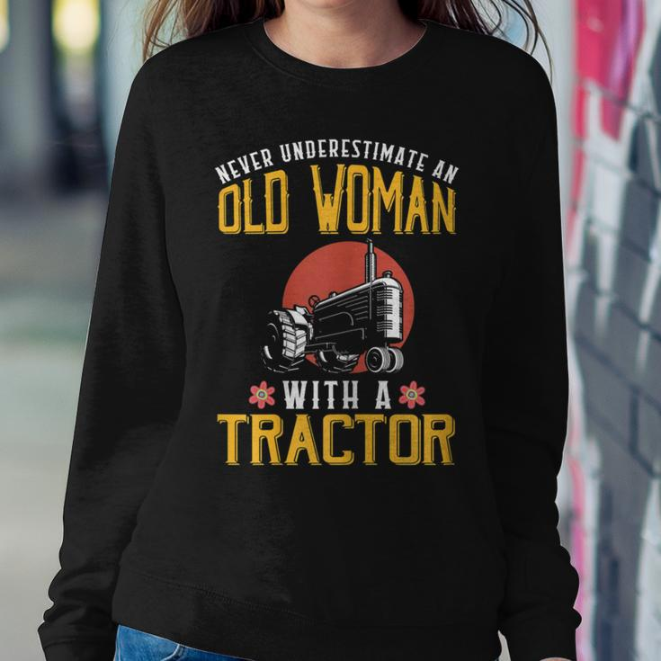 Never Underestimate An Old Woman With A Tractor Women Sweatshirt Unique Gifts