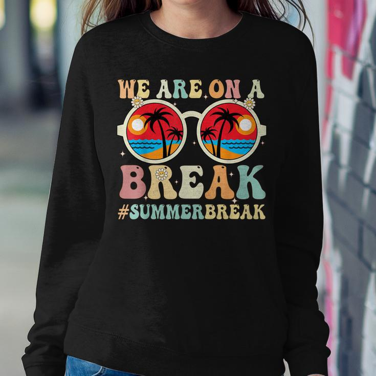 We Are On A Break Teacher Retro Groovy Summer Break Teachers Women Crewneck Graphic Sweatshirt Funny Gifts