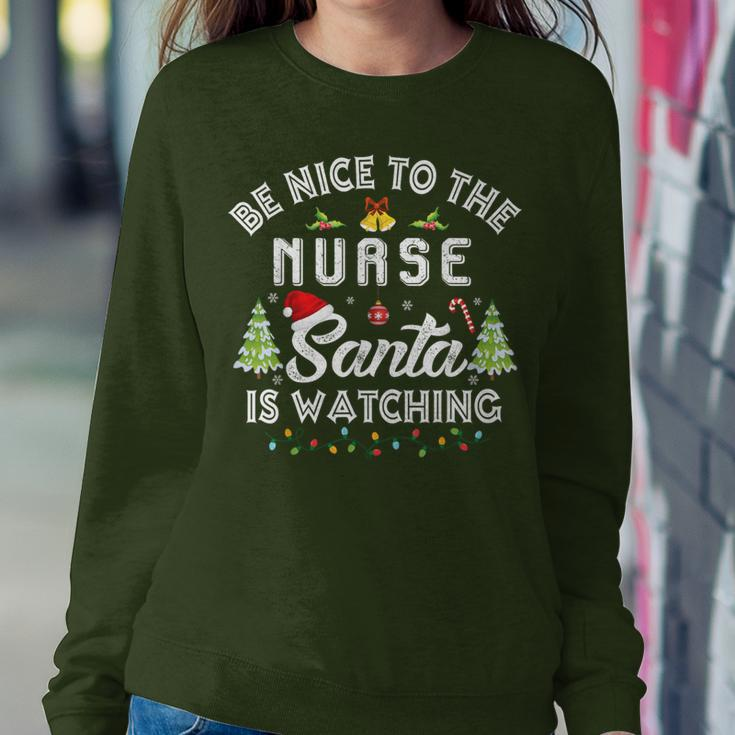 Be Nice To The Nurse Santa Is Watching Matching Christmas Women Sweatshirt Unique Gifts