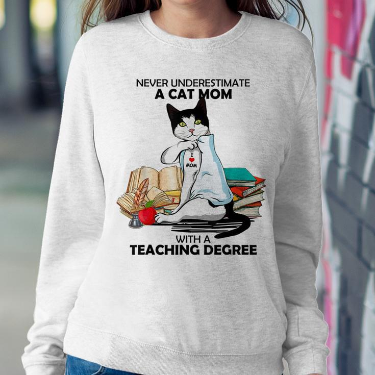 Never Underestimate A Cat Mom With A Teaching Degree Gift Women Crewneck Graphic Sweatshirt Funny Gifts