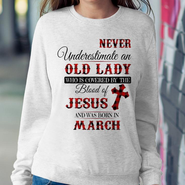 Never Underestimate An Old Lady Love Jesus Born In March Women Crewneck Graphic Sweatshirt Funny Gifts