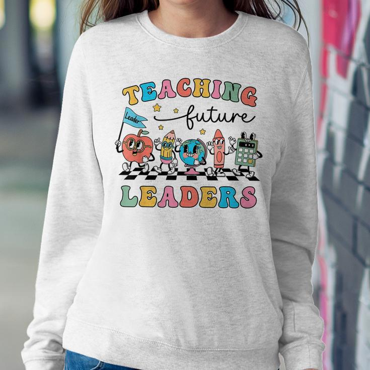 Retro Teaching Future Leaders Groovy Teacher Back To School Women Sweatshirt Funny Gifts