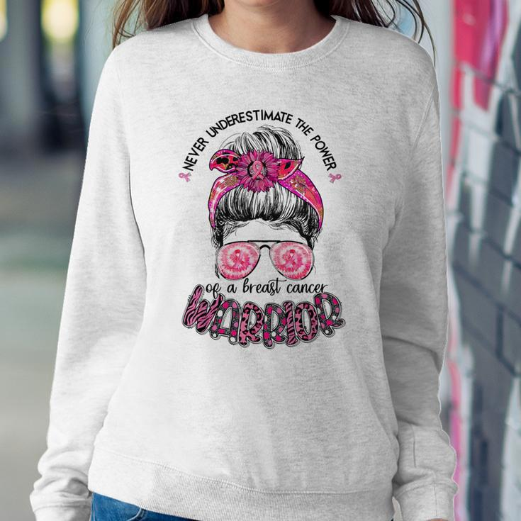 Never Underestimate Breast Cancer Warrior Messy Bun Ribbon Women Sweatshirt Funny Gifts