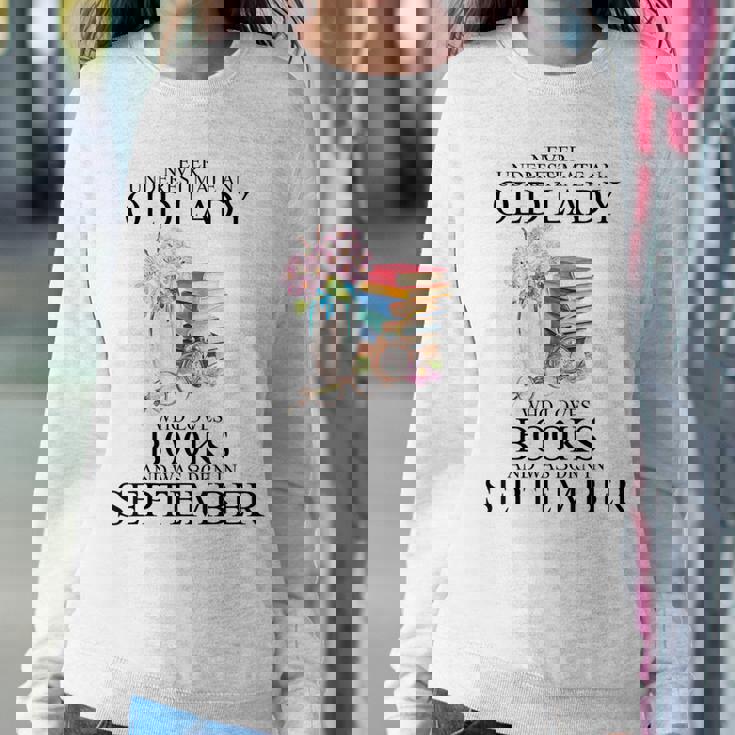 Never Underestimate An Old Lady Who Loves Books September Women Sweatshirt Unique Gifts