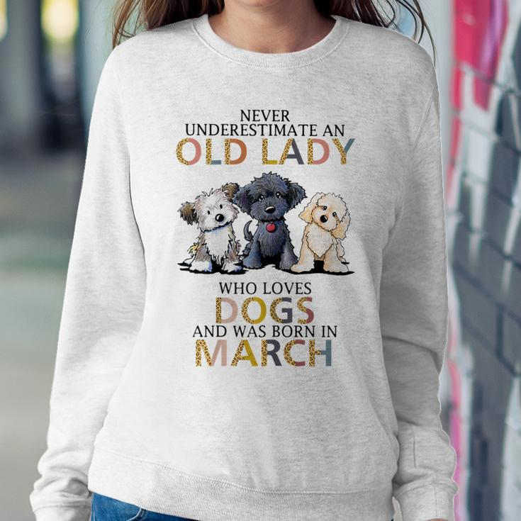 Never Underestimate Old Lady Loves Dogs Born In March Women Sweatshirt Funny Gifts