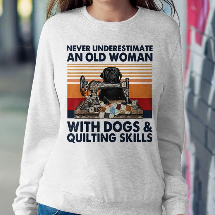 Never Underestimate An Old Woman With Dogs & Quilting Skills Women Sweatshirt Unique Gifts