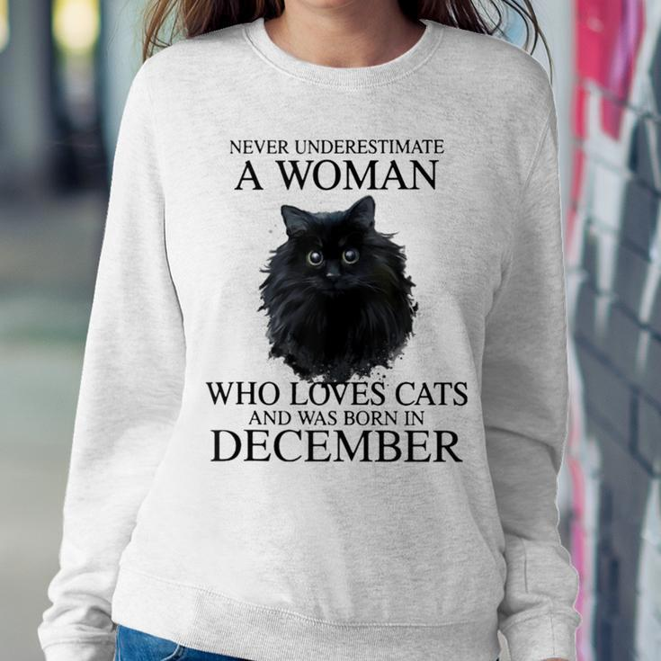 Never Underestimate A Woman Who Loves Cats Born In December Women Sweatshirt Funny Gifts