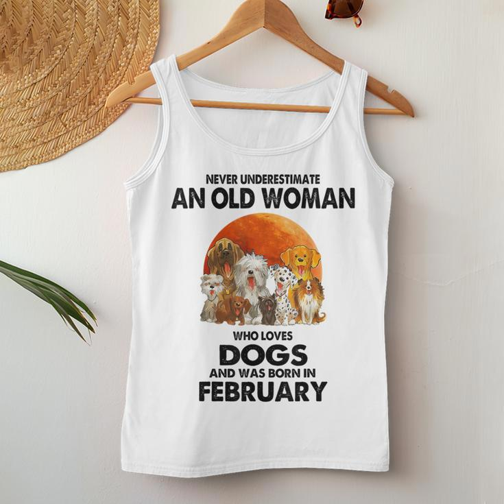 Never Underestimate An Old Woman Who Loves Dogs February Women Tank Top Personalized Gifts