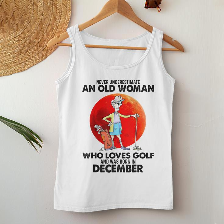 Never Underestimate An Old Woman Who Loves Golfs December Women Tank Top Funny Gifts