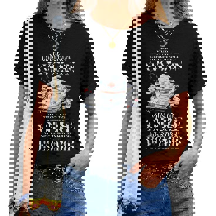 Never Underestimate A Woman Who Is Also A Nurse December Women T-shirt