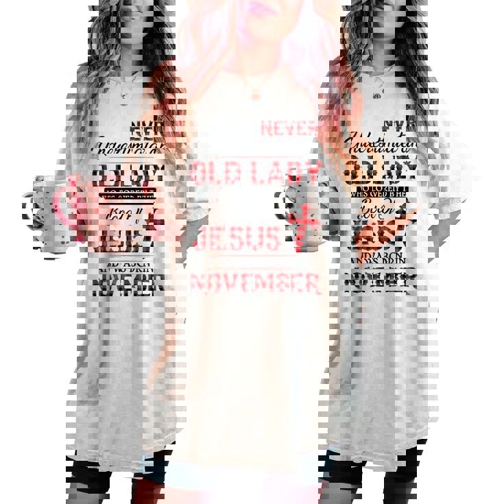 Never Underestimate An Old Lady Who Is Covered By-November Women's Oversized Comfort T-shirt