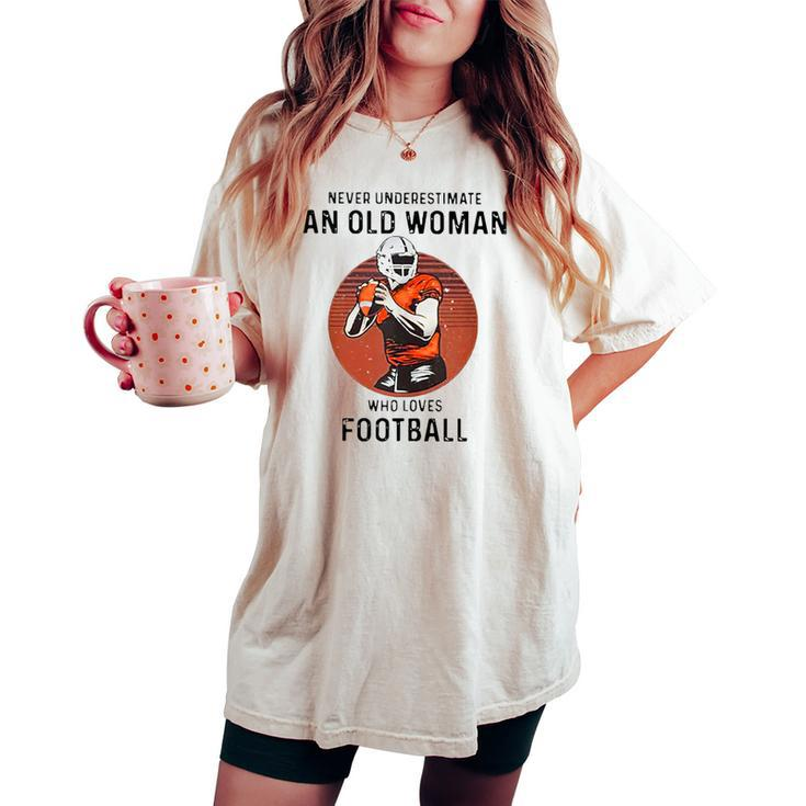 Never Underestimate An Old Woman Who Loves Football Women's Oversized Comfort T-shirt
