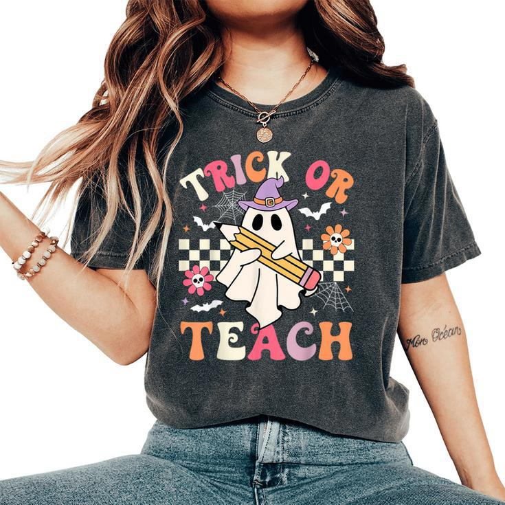 Trick Or Teach Groovy Teacher Halloween Retro Floral Ghost Women's Oversized Comfort T-Shirt