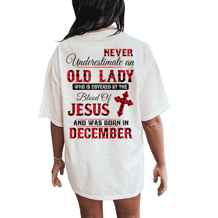 Never Underestimate An Old Lady Was Born In December Women's Oversized Comfort T-Shirt Back Print