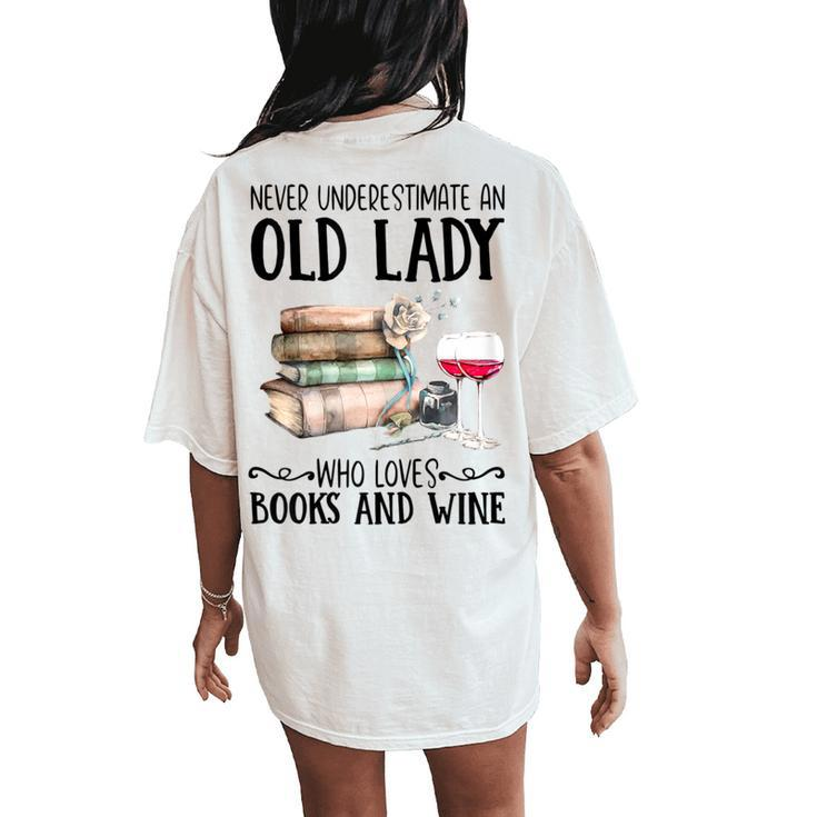 Never Underestimate An Old Lady Who Loves Books And Wine Women's Oversized Comfort T-Shirt Back Print