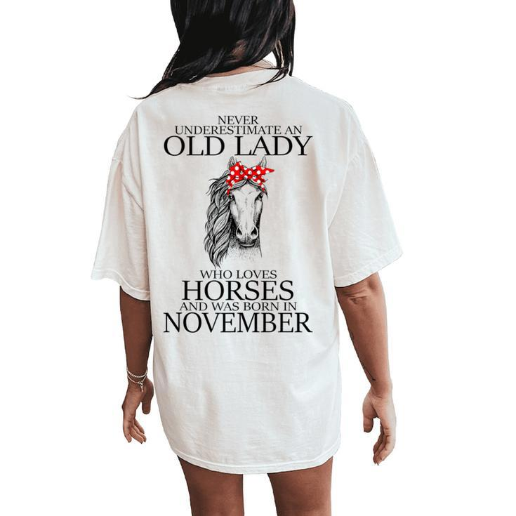 Never Underestimate An Old Lady Who Loves Horses November Women's Oversized Comfort T-Shirt Back Print