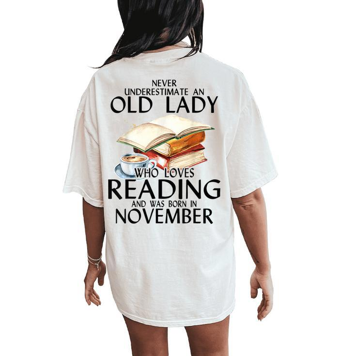 Never Underestimate An Old Lady Who Loves Reading November Women's Oversized Comfort T-Shirt Back Print