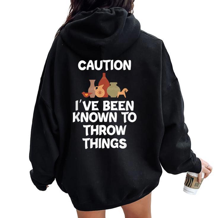 Caution I've Been Known To Throw Things Pottery Women Oversized Hoodie Back Print