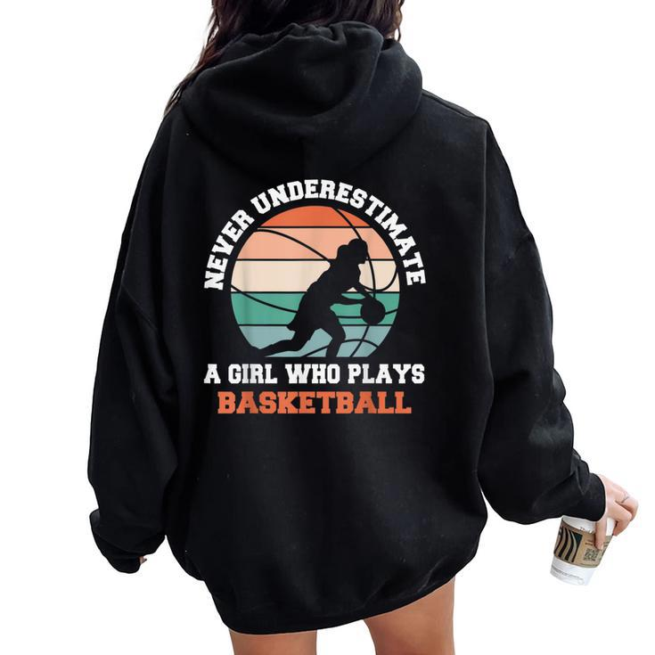 Never Underestimate A Girl Who Plays Basketball Women Oversized Hoodie Back Print