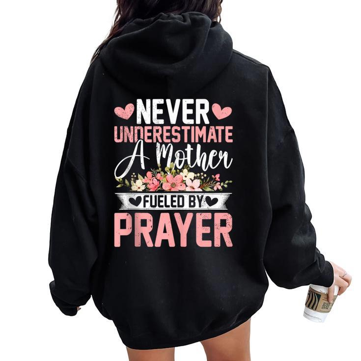 Never Underestimate A Mother Fueled By Prayer Mother's Day Women Oversized Hoodie Back Print