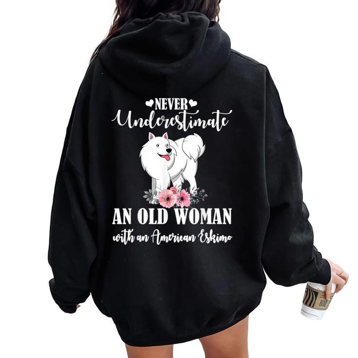 Never Underestimate An Old Woman With American Eskimo Women Oversized Hoodie Back Print