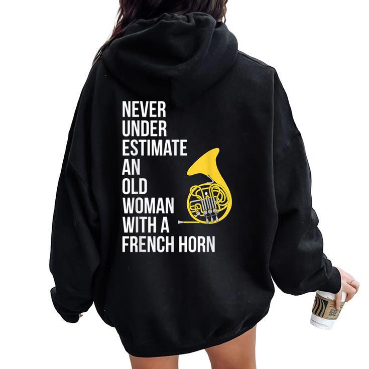 Never Underestimate An Old Woman With A French Horn Women Oversized Hoodie Back Print