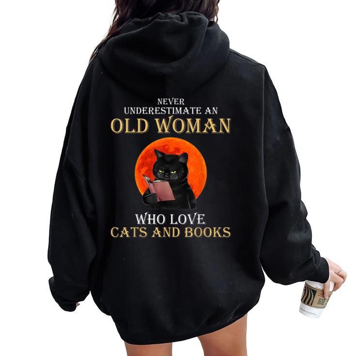 Never Underestimate An Old Woman Who Love Cats And Books Women Oversized Hoodie Back Print