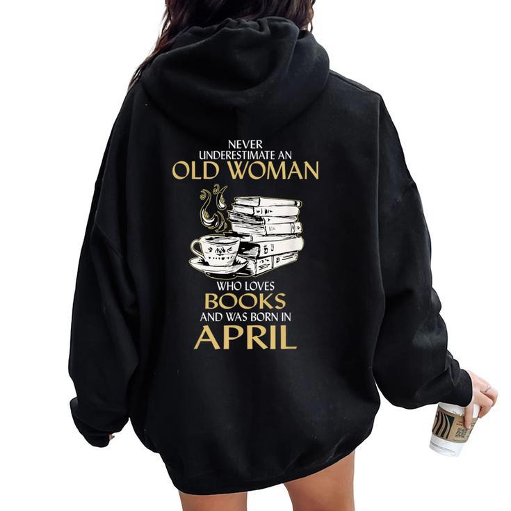 Never Underestimate An Old Woman Loves Books Born In April Women Oversized Hoodie Back Print