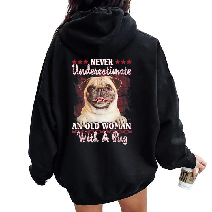 Never Underestimate An Old Woman With A Pug Women Oversized Hoodie Back Print