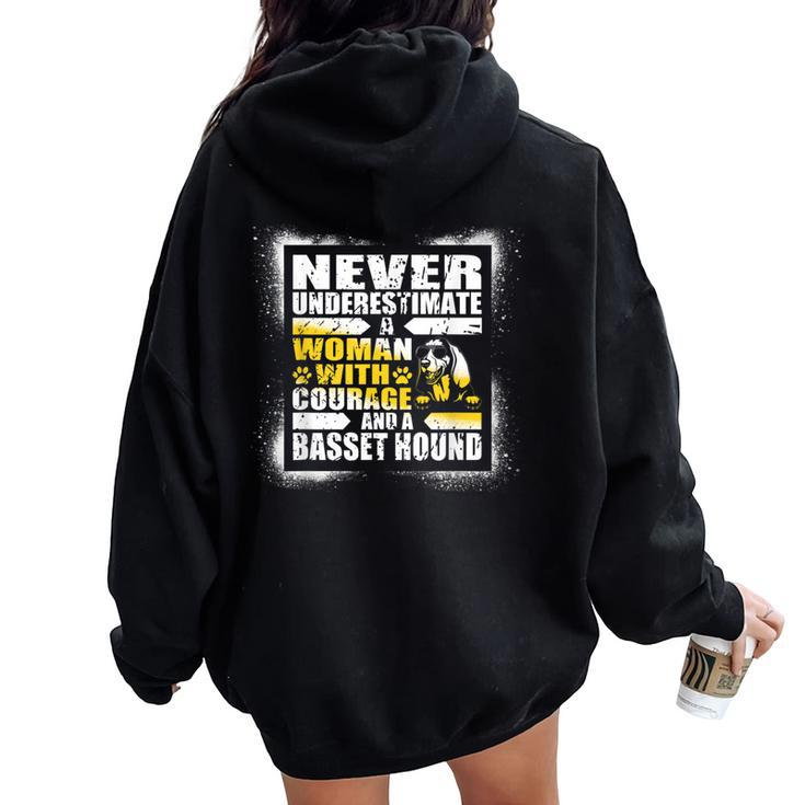 Never Underestimate Woman Courage And Her Basset Hound Women Oversized Hoodie Back Print