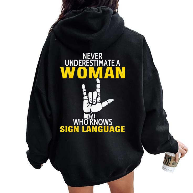 Never Underestimate A Woman Who Knows Sign Language Women Oversized Hoodie Back Print