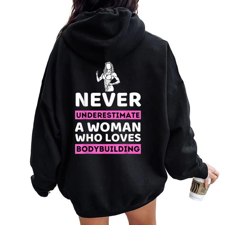 Never Underestimate A Woman Who Loves Bodybuilding Women Oversized Hoodie Back Print